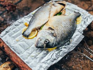 Cooking fish on a camp BBQ