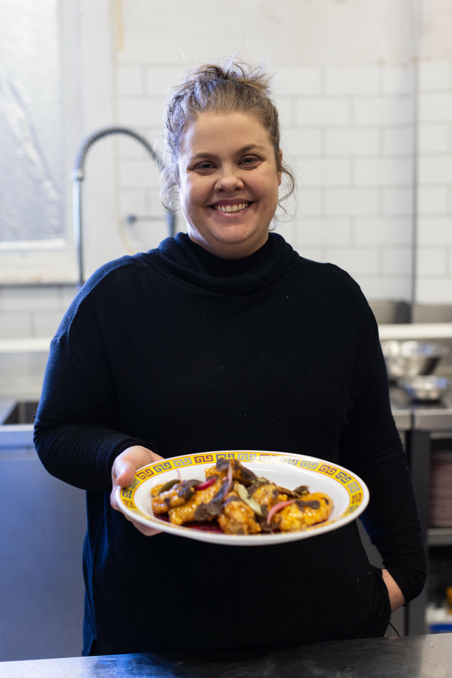 amy hamilton holding cooked truffle honey chicken wings
