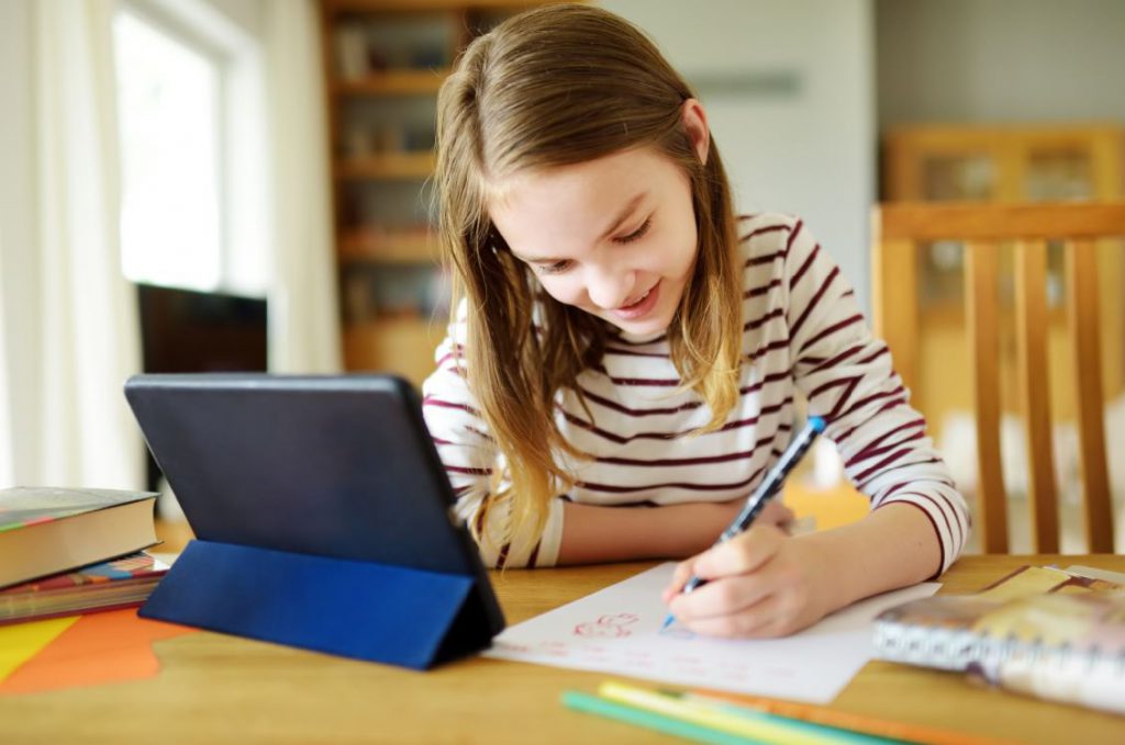 child learning at home on technology