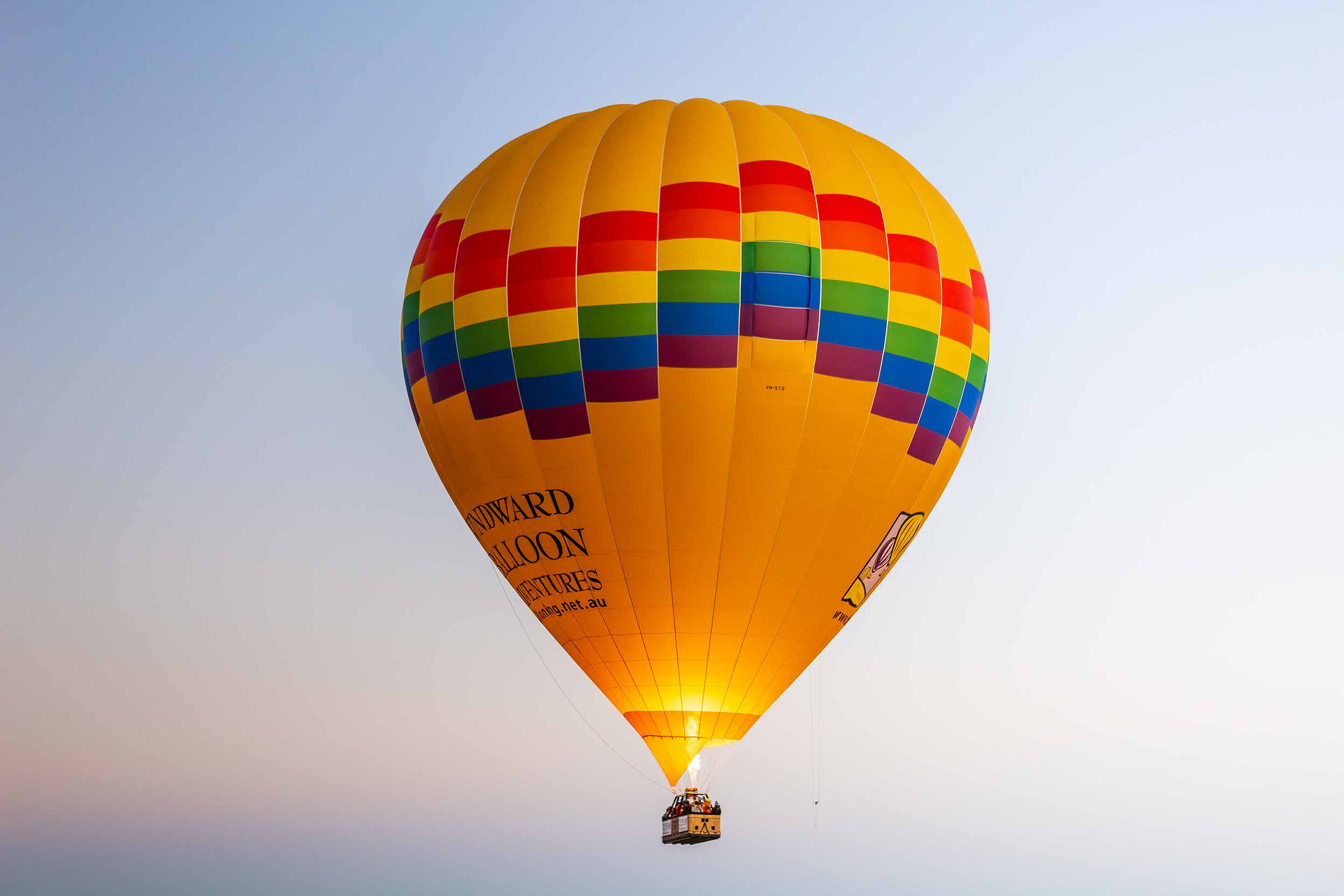 Northam Hot Air Balloon Local Matters LPG hot air balloon in air with gas flame burners lit